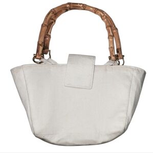 Hand bag cloth bag and where it is held is made of bamboo Color Cream